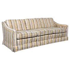 an upholstered striped couch on a white background