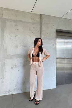 Good news -- we're restocking this style soon! If your size is sold out, select your size and register your email to be notified when it's available. Our Jaida Pant features a full length, cheeky style short lining, elastic band on the waist with drawstring, hollow crochet knit fabric and relaxed fit. Matching with Jaida Top and Suki Top. This garment has cheeky style short lining and stretchy. 85% Viscose, 15% Nylon. Please fold knitted garments. Do not hang to avoid stretching. Please refer to Runaway The Label, Full Length, Shirt Style, Tights, Shop Now, Relaxed Fit, Pants