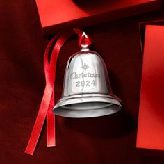 Lenox - Reed & Barton 2024 Silver Annual Christmas Bell Ornament - 40th Edition. From Reed & Barton, this 2024 sterling silver annual Christmas bell ornament is a classic addition to your treasured holiday collection. Engraved with "Christmas 2024" and features a festive red ribbon. Beautifully handcrafted by skilled silversmiths in the USA. Measures 2 3/4"H. Item(s) are safely and securely packaged. Christmas Bell, Bell Ornaments, Christmas Bells, Christmas 2024, Red Ribbon, Holiday Collection, Fine Jewelry, Ribbon, Christmas Ornaments