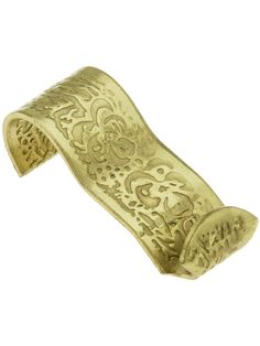 a gold bracelet with intricate designs on it