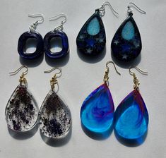 Unique handmade.  All items are one of a kind and not duplicated. Handmade resin dangle earrings.  Teardrop earrings are 2.75" long x 1-1/4" wide Square is about 1" x 1" CARE TIPS: Pendants are durable and waterproof, but should be kept away from heat sources. Do not store on the prolonged sunlight. It's best not to expose these pieces to chemicals or alcohol-based products such as perfume, hairspray, household cleaners or nail polish remover. If required clean with mild soap and water, and buff with a soft cloth. Try to separate resin jewelry to avoid nicks and scrapes. Blue Resin Teardrop Earrings, Handmade Resin Teardrop Earrings As Gift, Handmade Resin Teardrop Earrings, Handmade Teardrop Resin Earrings, Handmade Clear Resin Earrings, Handmade Drop Resin Jewelry, Unique Resin Dangle Earrings, Unique Teardrop Resin Earrings, Unique Dangle Resin Earrings