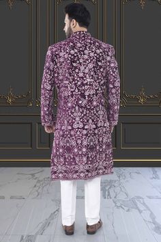 This Men's Sherwani features stunning floral thread embroidery with sequin and stone embellishments for a luxurious and elegant look, this sherwani is sure to make a statement. Exude confidence and style with this beautiful piece. Floral Thread Embroidery, Men Sherwani, Mens Sherwani, Exude Confidence, Elegant Look, Purple Guy, Thread Embroidery, This Man, Embellishments