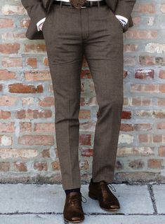 Experience the difference with our Hardy Minnis Dark Brown Twill Wool Pants. Impeccably tailored from the finest wool, the lustrous brown shade exudes dignified charm, further enhanced by the intricate twill weave that adds depth and texture to its appearance. Perfectly suited for high-stakes business meetings and prestigious social gatherings, it accentuates your stature, with every seam carefully placed to harmonize with your physique.   The "Enterprise" collection by Hardy Minnis, crafted from Huddersfield's rich textile heritage, offers luxurious Super 100s fabric weighing 210gsm. Ideal for suits and formal wear, this collection combines traditional and modern designs, ensuring smooth handling and year-round wearability. Elevate your style with the sophistication and quality of the "En Slim Fit Brown Bottoms For Business, Brown Slim Fit Tapered Leg Pants, Brown Slim Fit Bottoms With Welt Pockets, Brown Flat Front Dress Pants For Work, Slim Fit Brown Dress Pants With Tapered Leg, Brown Slim Fit Dress Pants With Tapered Leg, Business Brown Bottoms With Welt Pockets, Brown Straight Dress Pants For Business, Brown Tapered Leg Business Pants