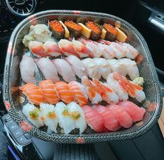 there are many sushi on the tray in the car