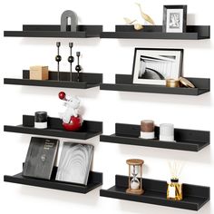 three black shelves with pictures and other items on them