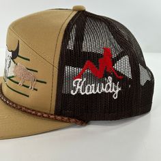 We embroidered all 3 sides of the hat. Western Style Adjustable Snapback Hat With Curved Brim, Western Style Adjustable Curved Brim Snapback Hat, Western Style Adjustable Snapback Hat, Western Style Adjustable Snapback Hat With Flat Brim, Adjustable Western Snapback Hat With Curved Brim, Adjustable Flat Bill Hat With Custom Embroidery, Western Style Adjustable Snapback Hat With Flat Bill, Adjustable Snapback Hat For Rodeo With Short Brim, Trucker Snapback Hat With Short Brim For Rodeo