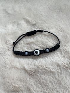 Beautiful Handmade Braided Evil Eye Bracelet in Black with Evil Eye. Use For Protection & Good Luck! Cheap Handmade Black Evil Eye Bracelet, Evil Eye Bracelet Braided, Casual Black Friendship Bracelet With Black Beads, Adjustable Black Evil Eye Bracelet, Black Adjustable Evil Eye Bracelet, Adjustable Black Friendship Bracelet, Black Adjustable Braided Bracelet With Sliding Knot, Adjustable Black Round Bracelets, Black Adjustable Bracelets