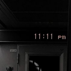 an open door with the numbers 11 11 pm