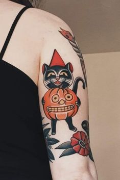 a woman with a cat tattoo on her arm