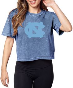 PRICES MAY VARY. This on trend cropped tee is perfect for gameday or lounging! This style features a cropped silhouette with short sleeves and rounded neckline. This mineral wash fabric gives an edgy look with a super soft hand feel. Screenprinted team graphic at center chest. NCAA officially licensed and proudly designed in the USA Graphic Tee For Cheerleading With Short Sleeves, Blue Graphic Tee Crop Top, Blue Graphic Crop Top T-shirt, Blue Graphic Cotton Cropped T-shirt, Graphic Tee T-shirt For Cheerleading, Short Sleeve, Sweet Tee, Cropped Tee, Edgy Look, Rounded Neckline