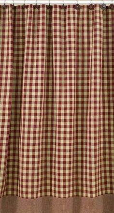 red and white checkered curtains hanging on the side of a window with brown trim