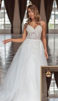 a woman in a white wedding dress posing for the camera