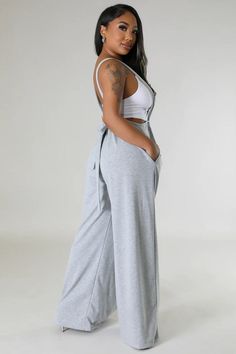 Stay cool, chic, and comfy all day in our Casual Sweatpant Jumpsuit. With a cool suspender-style look and wide legs, this jumpsuit takes casual to the next level. Perfect for everyday wear, you'll never want to take it off. pictured top is not part of the purchase Gray Cotton Jumpsuits And Rompers For Loungewear, Trendy Jumpsuits And Rompers For Spring Lounging, Trendy Wide Leg Jumpsuits And Rompers For Day Out, Gray Cotton Jumpsuits And Rompers For Summer, Gray Cotton Summer Jumpsuits And Rompers, Cotton Overall Jumpsuits And Rompers For Leisure, Solid Color Wide Leg Jumpsuits And Rompers For Loungewear, Wide Leg Solid Color Jumpsuits And Rompers For Loungewear, Casual Gray Jumpsuits And Rompers For Loungewear