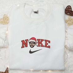 Introducing the Bad Bunny Head Santa Hat Christmas x Nike Embroidered Sweatshirt, a must-have for this holiday season! Made with Nike Embroidered Sweatshirt, Nightmare Before Christmas Hoodie, Disney Characters Christmas, Candy Cane Gifts, Santa Outfit, Santa Sweatshirt, Snoopy Christmas, Gaming Shirt, Embroidered Clothes