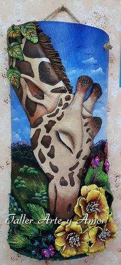 a painting of a giraffe is hanging on the wall