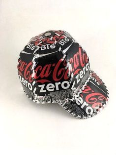 two coca - cola hats are stacked on top of each other, with the word zero printed on them