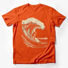 an orange t - shirt with a white drawing of a surfer riding a large wave