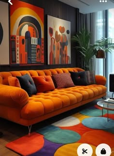 a living room with orange couches and colorful rugs