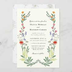 a wedding card with flowers and leaves on the front, featuring an ornate border design