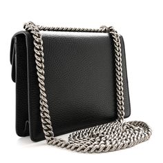 This is an authentic GUCCI Calfskin Mini Dionysus Shoulder Bag in Black. This chic bag is crafted of grained black calfskin leather. The bag features an aged silver chain strap and a textured silver horseshoe closure encrusted with smokey grey stones and tiger heads at each end. The front flap opens to a beige fabric interior. Tiger Head, Chic Bags, Shoulder Bag Black, Beige Fabric, Grey Stone, Chain Strap, Calf Skin, Silver Chain, The Bag