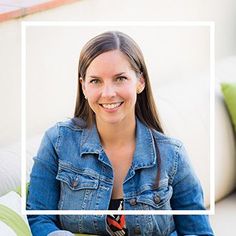 a woman sitting on a couch smiling at the camera