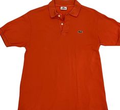 Get your street style on with this vintage Lacoste orange polo t-shirt! Unleash the vibrant spirit of authentic Lacoste fashion in bold, bright orange. Elevate your look and turn heads wherever you go  it's more than just a shirt, it's a statement!  TAG READS: Lacoste, size 4, Devenlay, Made in France, 100% Cotton Keep in mind vintage tag sizes vary from modern day sizing. MEASUREMENTS   (Taken in inches lying flat are approximately) LENGTH: 27 inches Measure from top to bottom. SHOULDERS: 18 inches Measure from shoulder to shoulder. CHEST:  20 inches Measure from arm pit to arm pit. BOTTOM WAIST: 21 inches Measure across bottom of garment. SLEEVE LENGTH: 14 inches Measure from neck to wrist. ARM CUFF: 5 inches Measure cuff width. Compare measurements to those of a similar garment you alre Y2k Streetwear Fashion, Orange Y2k, Lacoste Vintage, Polo Orange, Vintage Lacoste, Polo T Shirt, Arm Cuff, Vintage Polo, Star Shirt