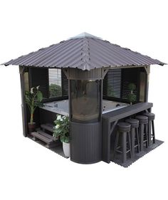 an outdoor hot tub with four stools next to it and a potted plant