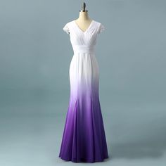 a dress on a mannequin with purple and white ombrella in the front