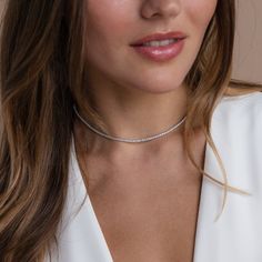 Give the gift of sparkle this holiday season with our Diamond Tennis Choker Necklace. Featuring dazzling diamond gemstones on a delicate chain, this versatile piece adds elegance to any look—from casual outings to glamorous date nights. A perfect Christmas gift to make someone shine. SKU: RR-NR152 Product Details Finish/Material: 18K Gold Over Brass ∙ Rhodium Over Brass, CZ Diamond Gemstones Featuring a Dainty ~2mm CZ Diamond Tennis Choker Necklace, available in 2 lengths: 14 Inches + 2 Inch Ext Caitlyn Minimalist, Jewelry Capsule, Tennis Choker Necklace, Initial Tag Necklace, Sideways Initial Necklace, Dainty Diamond Necklace, Diamond Huggies, On Date, Art Deco Diamond Rings