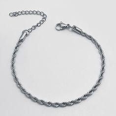 Crafted with meticulous attention to detail, this bracelet features a mesmerizing twisted chain design, adding a touch of glamour to any outfit. Whether you're dressing up for a special occasion or adding a chic accent to your everyday look, our bracelet is the perfect choice. Available in silver and gold Elegant Bracelets With Rope Chain And Link Shape, Elegant Bracelets With Rope Chain Link, Elegant Bracelets With Link Rope Chain, Elegant Rope Chain Link Bracelets, Elegant Stainless Steel Braided Bracelet, Elegant Rope Chain Link Bracelet, Elegant Twisted Silver Bracelets, Elegant Silver Twisted Bracelet, Mini Twists