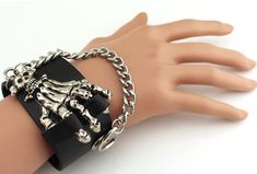 This rugged yet stylish 3-piece spike studded leather bracelet set makes a bold statement. Crafted from high-quality leather and metal accents, this unisex bracelet set is perfect for punk rockers, bikers, and anyone with an edgy sense of style. The adjustable straps and knuckle rings allow you to achieve the perfect fit and look. Show off your rebellious spirit with the punk-inspired spikes, or channel your inner biker with the metallic rivet details. These bracelets transition seamlessly from Cheap Punk Bracelets With Rivets, Pirate Bracelet, Surprise Your Girlfriend, Punk Inspiration, Gothic Accessories, Bracelet Chain, Unisex Bracelets, Studded Leather, American Express