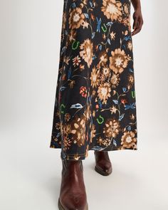 The Printed Linen Skirt with Removable Leather Tie Belt in Dark Mix by Dorothee Schumacher is a bias cut, maxi skirt crafted an all over print with a frayed waistband and hemline. Removable leather tie belt 100% Linen, The outer linen fabric has been certified with the EUROPEAN FLAX® label, which proves traceability at every step of linen processing. #658905 Ankle-length Relaxed Maxi Skirt With Lining, Printed Relaxed Midi Skirt, Fall Multicolor Relaxed Maxi Skirt, Multicolor Maxi Skirt For Fall With Relaxed Fit, Relaxed Multicolor Maxi Skirt For Fall, Long Floral Print Relaxed Skirt, Relaxed Long Floral Skirt, Fall Floral Print Relaxed Maxi Skirt, Fall Floral Print Flared Maxi Skirt