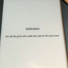 a white tablet with the words dedication written on it