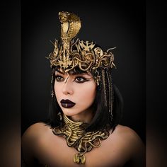 The golden crown is decorated in the Egyptian style, it is decorated with a decorative cobra, snakes, chains, rhinestones on a metal ribbon and Egyptian symbols. Crown for the image of Cleopatra. The crown will be a great addition to makeup, Halloween, ball, wedding, party, carnival, festival, pregnancy photo shoot. Any experienced photographer or makeup artist can use a crown as a great art photography prop. The crown can be purchased individually or in a set with other accessories: SET 1 inclu Cleopatra Crown, Cleopatra Style, Tiara Gold, Medusa Gorgon, Goddess Crown, Halloween Ball, Crown Gold, Gold Headpiece, Crown Necklace