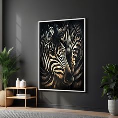 two zebras standing next to each other in front of a painting on the wall