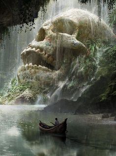 there is a man in a boat on the water next to a giant rock and waterfall