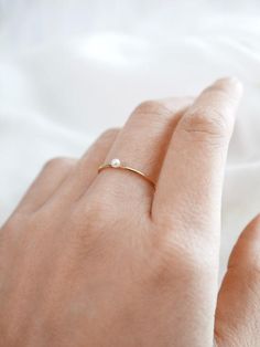 Minimalist Pearl Rings With Pearl Charm, Minimalist Everyday Stackable Pearl Ring, Minimalist Everyday Pearl Ring, Delicate Everyday Pearl Ring, Everyday Minimalist Pearl Ring, Dainty Everyday Pearl Drop Ring, Minimalist Pearl Drop Ring, Dainty Tiny Pearl Ring For Everyday, Everyday Minimalist 14k Gold Pearl Ring