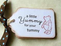 a little yummy for your tummy ornament on a brown and blue ribbon