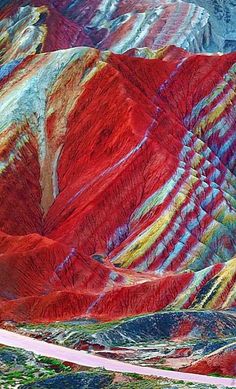 the colorful mountains and valleys are painted with different colors in this photo, there is no image here to provide a caption for