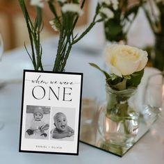 there are two baby pictures on the table with flowers in vases next to it