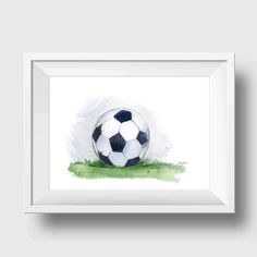 a watercolor painting of a soccer ball sitting on the grass in front of a wall