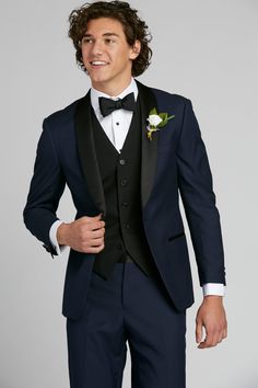 Think timeless, classic tuxedo, and then turn it up. The navy shawl lapel tuxedo is a true style piece, both unexpected and endlessly sharp. A satin, black shawl lapel is set against deep navy blue for a refined contrast. Black Tuxedo With Shawl Collar For Wedding, Black Shawl Collar Tuxedo For Wedding, Blue Tuxedo Blazer, Blue Tuxedo Blazer For Black-tie Events, Navy Tuxedo Style Three-piece Suit For Formal Occasions, Black Tie Tuxedo Outerwear, Navy Tuxedo For Formal Occasions, Navy Three-piece Tuxedo For Formal Occasions, Blue Tuxedo Style Evening Outerwear