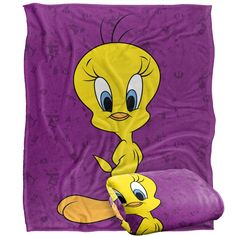 an image of a cartoon character on a purple blanket and pillow with the word'tweety'printed on it