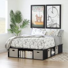 a bed with two storage bins underneath it