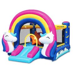 an inflatable bounce house with a unicorn slide