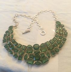 "(MARKED DOWN FROM $75.00) This is beautiful vintage peridot (Glass/crystal?)necklace made with 925 sterling silver. This necklace is in very good vintage condition. The necklace is 18\" in length. As you can see from photo's the stones are absolutely beautiful and set in 925 sterling silver." Green Faceted Necklace For Party, Sterling Silver Green Jewelry With Jewels, Unique Faceted Green Jewelry, Green Sterling Silver Jewelry With Jewels, Unique Green Faceted Jewelry, Green Faceted Jewelry For Weddings, Green Nickel-free Costume Jewelry, Unique Green Jeweled Jewelry, Green Sterling Silver Necklace With Jewels