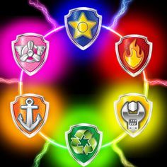 four different colored shields with symbols on them in the shape of an arrow and lightning