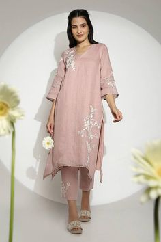 Blush pink anchor thread hand embroidered tunic featuring 3D embossed gold petal floral work. Paired with a pant. - Aza Fashions Hand Embroidered Tunics, Asymmetric Tunic, Anchor Threads, Tunics Online, Pink Thread, Floral Work, Pink Tunic, Fly Free, Embroidery Neck Designs