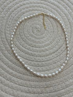 Elevate your jewelry collection with this 18k gold-plated Freshwater Pearl White necklace. Made with 925 Sterling Silver, the minimalist design is perfect for any occasion. Show off your signature style with a timeless and elegant look. White Necklace, The Minimalist, Signature Style, Pearl White, Fresh Water, Freshwater Pearls, Minimalist Design, Jewelry Collection, 18k Gold