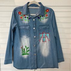 Nwot- Never Worn Small Denim, Long Sleeve, Snaps Embroidered Details. Medium Wash Floral Embroidered Tops For Fall, Medium Wash Floral Embroidery Top For Fall, Fall Medium Wash Tops With Floral Embroidery, Fall Medium Wash Top With Floral Embroidery, Embroidered Denim Blue Top For Fall, Embroidered Denim Tops For Fall, Casual Embroidered Denim Top For Fall, Casual Long Sleeve Denim Top With Floral Embroidery, Blue Embroidered Shirt For Fall